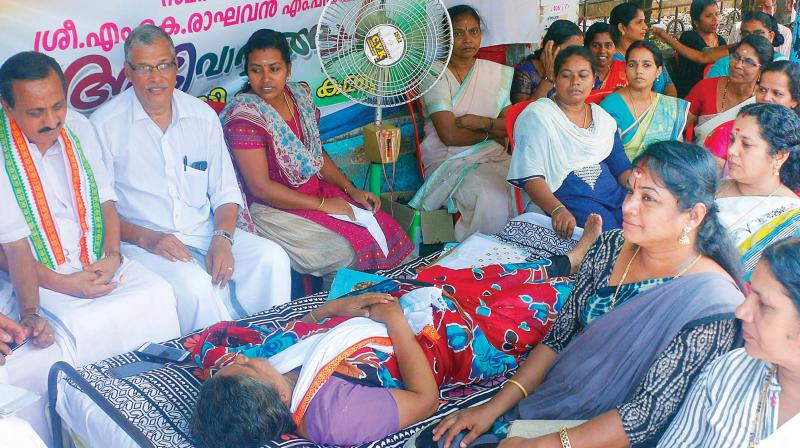 M.K. Raghavan, MP, on a 12-hour hunger strike expressing solidarity with the MCH temporary staff at Kozhikode on Friday —DC M.K. Raghavan, MP, on a 12-hour hunger strike expressing solidarity with the MCH temporary staff at Kozhikode on Friday —DC