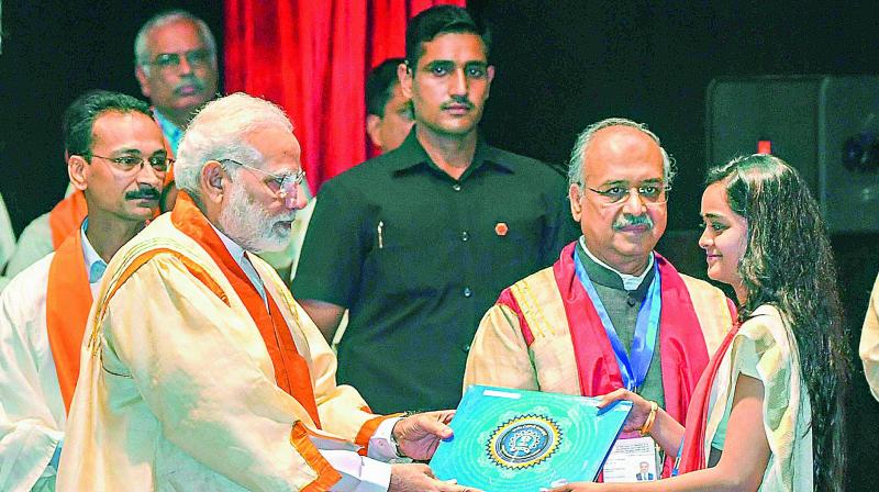 Prime Minister Narendra Modi presents citation to a student during the 56th annual convocation of the Indian Institute of Technology, Bombay, on Saturday. (Photo: PTI) Prime Minister Narendra Modi presents citation to a student during the 56th annual convocation of the Indian Institute of Technology, Bombay, on Saturday. (Photo: PTI)