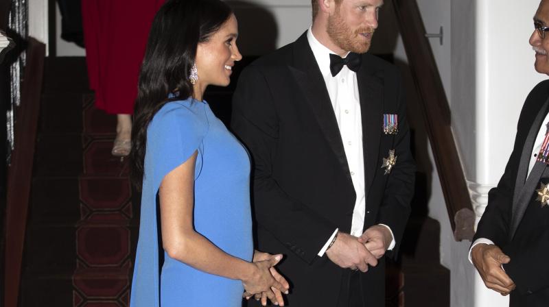 Britain's Prince Harry and Meghan, Duchess of Sussex at the official dinner in Suva, Fiji, Tuesday, Oct. 23, 2018. Prince Harry and his wife Meghan are on day eight of their 16-day tour of Australia and the South Pacific. (Photo: AP) Britain's Prince Harry and Meghan, Duchess of Sussex at the official dinner in Suva, Fiji, Tuesday, Oct. 23, 2018. Prince Harry and his wife Meghan are on day eight of their 16-day tour of Australia and the South Pacific. (Photo: AP)