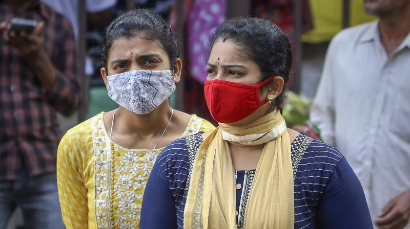 People wearing face masks as a precautionary measure after cases of COVID-19 sub-variant JN.1 were detected in the country, in Bengaluru (PTI Photo)