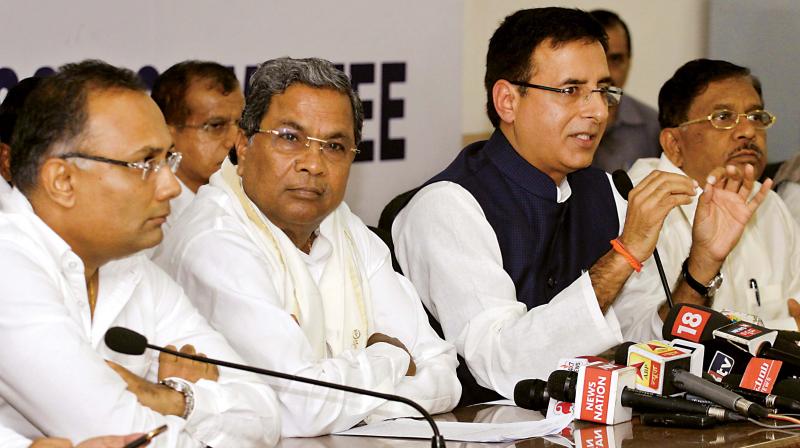 Congress spokesman Randeep Singh Surjewala addresses the media with CM Siddaramaiah, KPCC chief Dr G. Parameshwar and KPCC working president Dinesh Gundurao in Bengaluru on Tuesday. (Photo: DC) Congress spokesman Randeep Singh Surjewala addresses the media with CM Siddaramaiah, KPCC chief Dr G. Parameshwar and KPCC working president Dinesh Gundurao in Bengaluru on Tuesday. (Photo: DC)