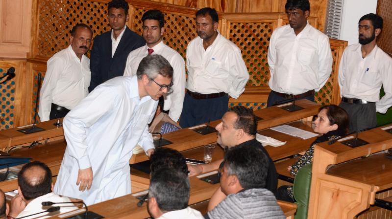 Former Chief Minister of Jammu and Kashmir and Leader of Opposition National Conference Omar Abdullah discussing with his party MLAs during the Special Session of Legislative Assembly called to pass the Goods and Services Tax (GST) bill, in Srinagar on Wednesday. (Photo: PTI) Former Chief Minister of Jammu and Kashmir and Leader of Opposition National Conference Omar Abdullah discussing with his party MLAs during the Special Session of Legislative Assembly called to pass the Goods and Services Tax (GST) bill, in Srinagar on Wednesday. (Photo: PTI)