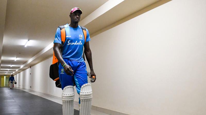 Jason Holder was suspended and fined 40 percent of his match fee for a slow over-rate during the Caribbean side's famous 10-wicket thrashing of England in the second Test at Antigua. (Photo: AFP) Jason Holder was suspended and fined 40 percent of his match fee for a slow over-rate during the Caribbean side's famous 10-wicket thrashing of England in the second Test at Antigua. (Photo: AFP)