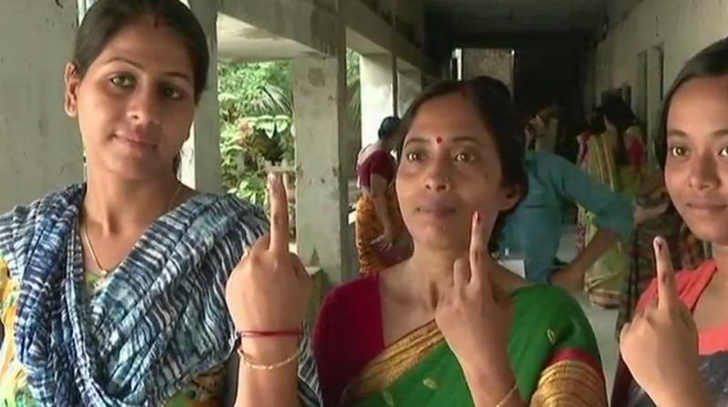 People outside a polling booth in Palghar. (Photo: ANI/Twitter) People outside a polling booth in Palghar. (Photo: ANI/Twitter)