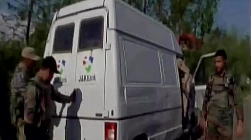 Five J&K policemen and two bank employees were killed when gunmen attacked a cash van in southern Kulgam district on Monday afternoon. (Photo: ANI/Twitter) Five J&K policemen and two bank employees were killed when gunmen attacked a cash van in southern Kulgam district on Monday afternoon. (Photo: ANI/Twitter)