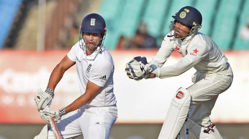 England batsman Alastair Cook plays a shot on the fourth day of the first test cricket match against India in Rajkot on Saturday (Photo: AP) England batsman Alastair Cook plays a shot on the fourth day of the first test cricket match against India in Rajkot on Saturday (Photo: AP)