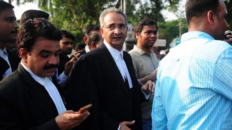 Lawyer Tanveer Ahmed Mir (Centre) on Friday confirmed that he will be defending the 16-year-old student accused in the murder of Pradyuman Thankur in Gurgaon's Ryan International School. (Photo: AFP) Lawyer Tanveer Ahmed Mir (Centre) on Friday confirmed that he will be defending the 16-year-old student accused in the murder of Pradyuman Thankur in Gurgaon's Ryan International School. (Photo: AFP)