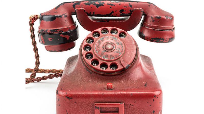 Originally a black Bakelite phone, later painted crimson and engraved with Hitler's name, the relic was found in the Nazi leader's Berlin bunker in 1945 following the regime's defeat. Photo Credit: Alexander Historical Auctions Originally a black Bakelite phone, later painted crimson and engraved with Hitler's name, the relic was found in the Nazi leader's Berlin bunker in 1945 following the regime's defeat. Photo Credit: Alexander Historical Auctions