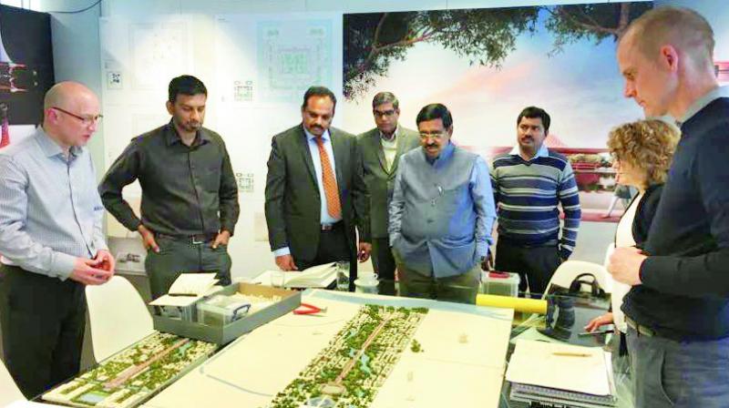 Minister P. Narayana and CRDA commissioner Cherukuri Sridhar watch the Norman Foster designs of the Amaravati capital region at London on Thursday. Minister P. Narayana and CRDA commissioner Cherukuri Sridhar watch the Norman Foster designs of the Amaravati capital region at London on Thursday.