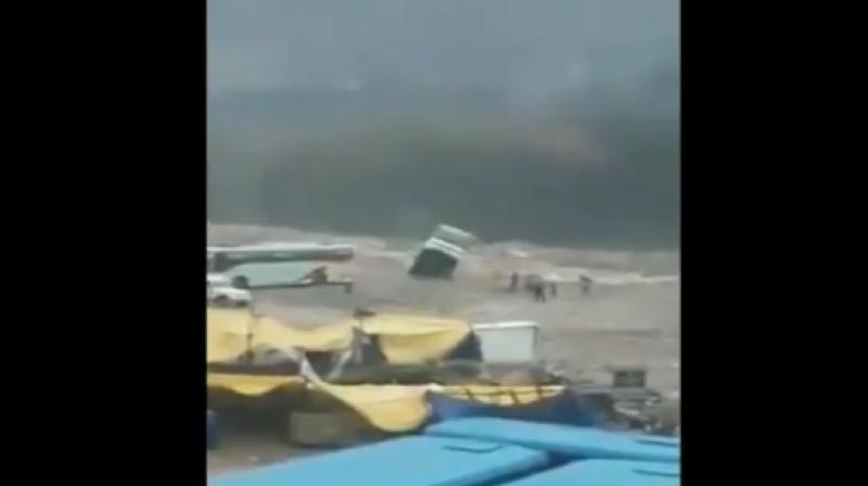 The bus was empty when it was washed away into the flooded Beas River. (Photo: Screengrab | ANI) The bus was empty when it was washed away into the flooded Beas River. (Photo: Screengrab | ANI)