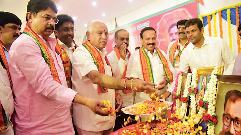 BJP leaders B.S. Yeddyurappa, D.V. Sadananda Gowda and R. Ashok inaugurate a meeting of the city unit of the party in Bengaluru on Saturday. (Photo: DC) BJP leaders B.S. Yeddyurappa, D.V. Sadananda Gowda and R. Ashok inaugurate a meeting of the city unit of the party in Bengaluru on Saturday. (Photo: DC)