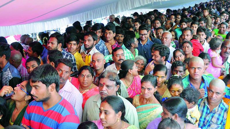 Parents perform Aksharabhyasam to their children at Trisakthi peetham on the occasion of Moola Nakshathram in Vijayawada on Wednesday. Parents perform Aksharabhyasam to their children at Trisakthi peetham on the occasion of Moola Nakshathram in Vijayawada on Wednesday.