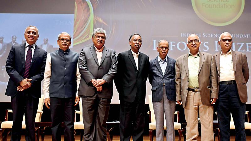 CEO and MD of Infosys Salil Parekh with Co-Founder Infosys and Trustee Kris Gopalakrishnan, Co-Founder Infosys and Non Executive Chairman of Board Nandan Nilekeni, Co-Founder Infosys and President - Board trustee S D Shibulal, Founder Infosys N R Narayana Murthy, Co-Founder Infosys and Trustee K Dinesh and Former Director Infosys and Trustee Srinath Batni during the announcement of Infosys Prize 2019 at Infosys Campus , in Bengaluru on Thursday (Photo: R Samuel)