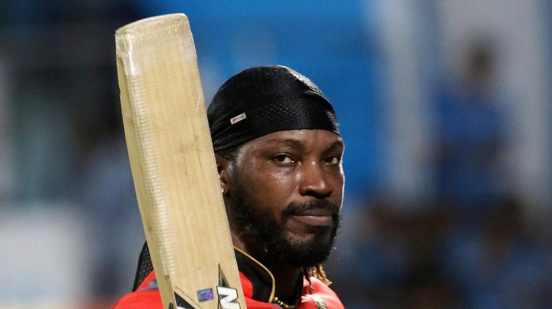 Chris Gayle, who returned to form with a smashing 77 against Gujarat Lions to guide Royal Challengers Bangalore to 21-run win, also became the first cricketer to score 10,000 runs in Twenty20 cricket. (Photo: PTI) Chris Gayle, who returned to form with a smashing 77 against Gujarat Lions to guide Royal Challengers Bangalore to 21-run win, also became the first cricketer to score 10,000 runs in Twenty20 cricket. (Photo: PTI)