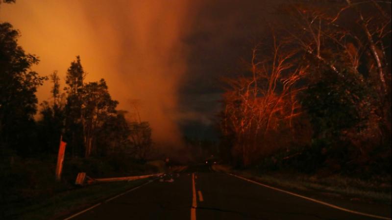 As magma destroyed four more homes, molten rock from two huge cracks merged into a single stream, threatening to block escape routes. (Photo: AFP) As magma destroyed four more homes, molten rock from two huge cracks merged into a single stream, threatening to block escape routes. (Photo: AFP)