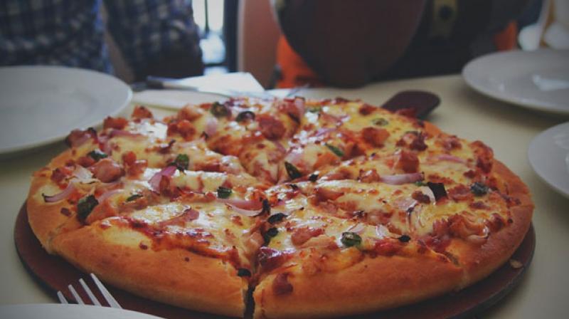 Defying all the traditionally held notions about what constitutes healthy food, some nutritionists are giving a thumbs-up to pizzas and burgers for breakfast. (Picture Courtesy: Pixabay) Defying all the traditionally held notions about what constitutes healthy food, some nutritionists are giving a thumbs-up to pizzas and burgers for breakfast. (Picture Courtesy: Pixabay)