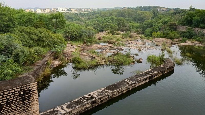 Water overflows from the gates after the tank level of Osman Sagar became full on Wednesday. Authorities will open the gates anytime if it rains heavyily. R.Pavan