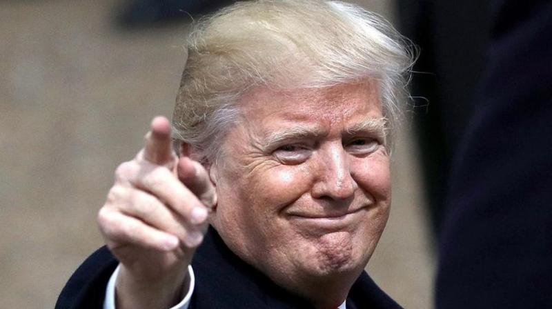 US President Donald Trump gestures to supporters during the Inaugural Parade on January 20 in Washington, DC. (Photo: AFP) US President Donald Trump gestures to supporters during the Inaugural Parade on January 20 in Washington, DC. (Photo: AFP)