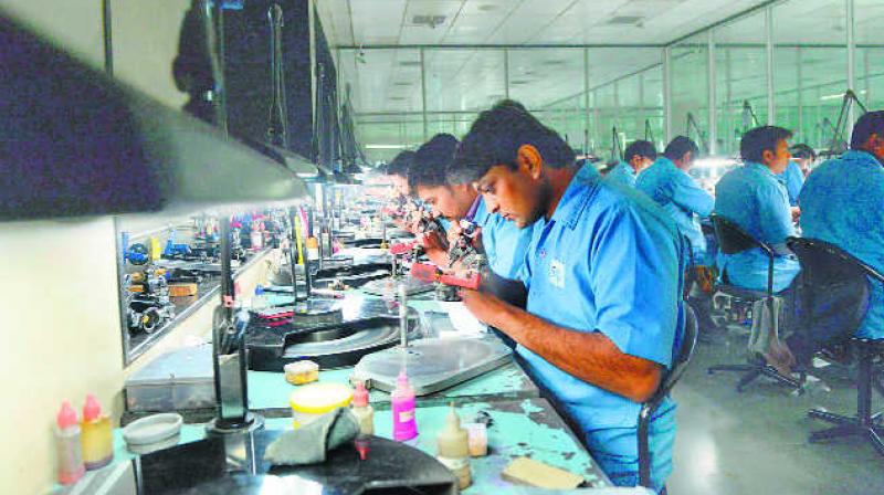 Workers checking quality of diamonds. (Representational Image/AFP) Workers checking quality of diamonds. (Representational Image/AFP)