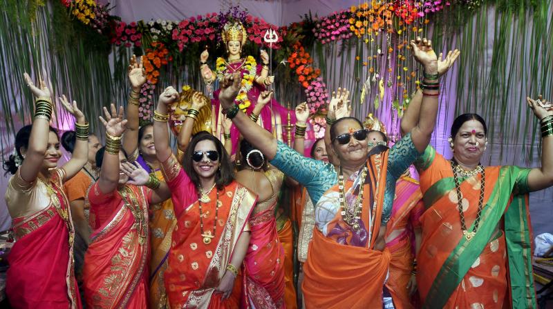 Women dance on the occasion of Lalita Panchami during Navratri celebrations at a pandal, in Mumbai (Photo: PTI) Women dance on the occasion of Lalita Panchami during Navratri celebrations at a pandal, in Mumbai (Photo: PTI)