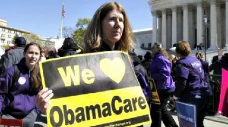 Although initial enrolment is about 4 percent lower than last year, the sizable number of sign-ups illustrates the risk Republicans face as they begin moving to dismantle the Affordable Care Act. (Photo: Representational Image/AFP) Although initial enrolment is about 4 percent lower than last year, the sizable number of sign-ups illustrates the risk Republicans face as they begin moving to dismantle the Affordable Care Act. (Photo: Representational Image/AFP)
