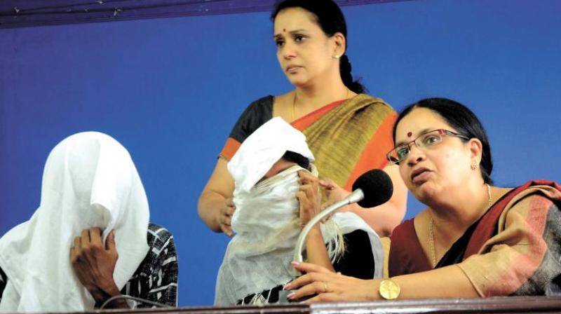 Dubbing artiste Bhagyalakshmi and actor Mala Parvathy along with the gangrape victim and her husband (wearing masks) at a press meet in Thiruvananthapuram on Thursday (Photo: Peethambaran Payyeri) Dubbing artiste Bhagyalakshmi and actor Mala Parvathy along with the gangrape victim and her husband (wearing masks) at a press meet in Thiruvananthapuram on Thursday (Photo: Peethambaran Payyeri)
