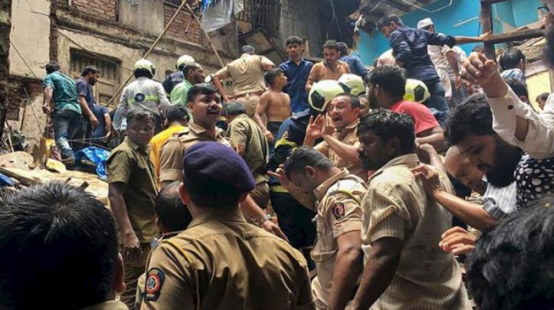 Mumbai’s congested Dongri area has gone up to 13 — five men, three women, four minor boys and a minor girl — while 10 people in total were injured. (Photo: AP) Mumbai’s congested Dongri area has gone up to 13 — five men, three women, four minor boys and a minor girl — while 10 people in total were injured. (Photo: AP)