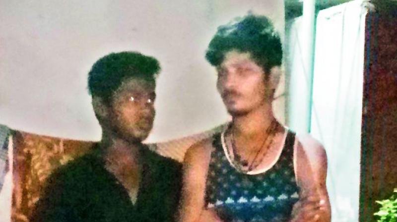 The two men who were caught by the locals and handed over to the police for capturing cats. The two men who were caught by the locals and handed over to the police for capturing cats.
