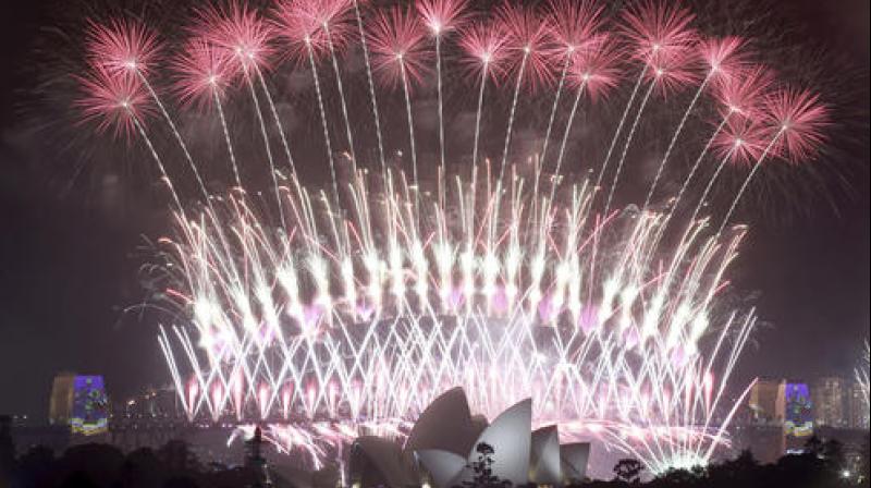 Fireworks explode over the Sydney Opera House and Harbour Bridge as New Year's celebrations are underway in Sydney. (Photo: AP) Fireworks explode over the Sydney Opera House and Harbour Bridge as New Year's celebrations are underway in Sydney. (Photo: AP)