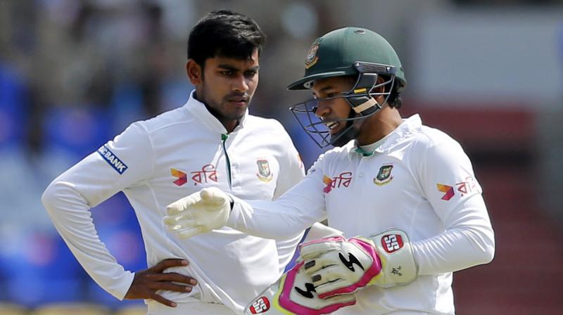 Mehedi Hasan (L) consults skipper Mushfiqur Rahim. (Photo: AP) Mehedi Hasan (L) consults skipper Mushfiqur Rahim. (Photo: AP)