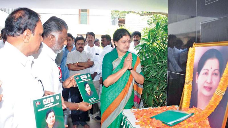 Sasikala Natarajan pays tribute to late J. Jayalalithaa after she was appointed as AIADMK general secretary through a resolution passed by the party’s general council, in Chennai, on Thursday. (Photo: DC) Sasikala Natarajan pays tribute to late J. Jayalalithaa after she was appointed as AIADMK general secretary through a resolution passed by the party’s general council, in Chennai, on Thursday. (Photo: DC)