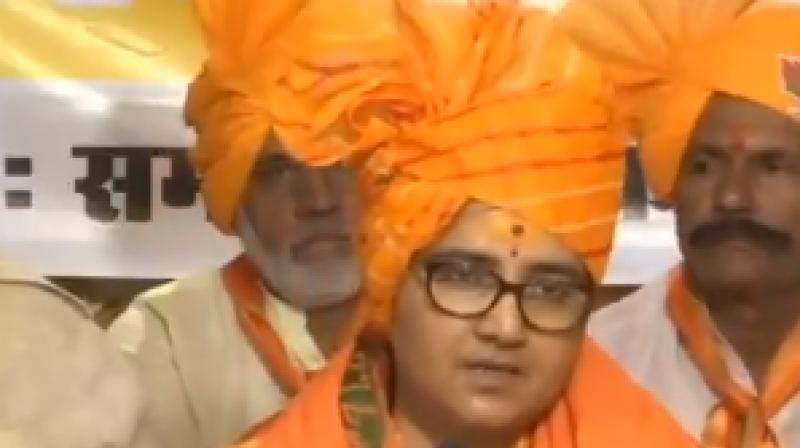 Addressing BJP workers in Bhopal, Thakur claimed Karkare died as she "cursed" him for 'torturing' her in custody. (Image: ANI twitter) Addressing BJP workers in Bhopal, Thakur claimed Karkare died as she "cursed" him for 'torturing' her in custody. (Image: ANI twitter)