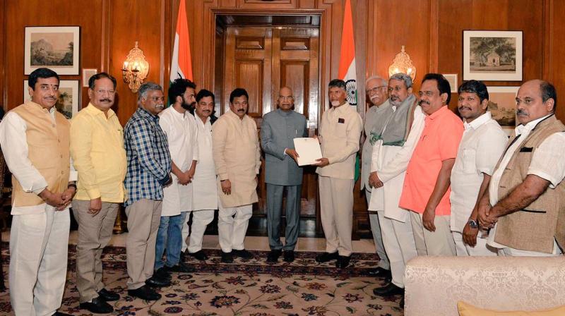 A delegation led by Andhra Pradesh Chief Minister N Chandrababu Naidu submits a memorandum to President Ram Nath Kovind regarding the status of implementation of assurances made in the parliament during the passing of AP Reorganisation Act, 2014. (Photo: ANI | Twitter) A delegation led by Andhra Pradesh Chief Minister N Chandrababu Naidu submits a memorandum to President Ram Nath Kovind regarding the status of implementation of assurances made in the parliament during the passing of AP Reorganisation Act, 2014. (Photo: ANI | Twitter)