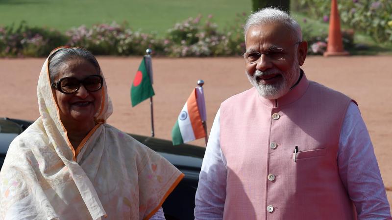 Prime Minister Narendra Modi with his Bangladeshi counterpart Sheikh Hasina during the ceremonial reception at the forecourt of Rashtrapati Bhawan in New Delhi. (Photo: PTI) Prime Minister Narendra Modi with his Bangladeshi counterpart Sheikh Hasina during the ceremonial reception at the forecourt of Rashtrapati Bhawan in New Delhi. (Photo: PTI)