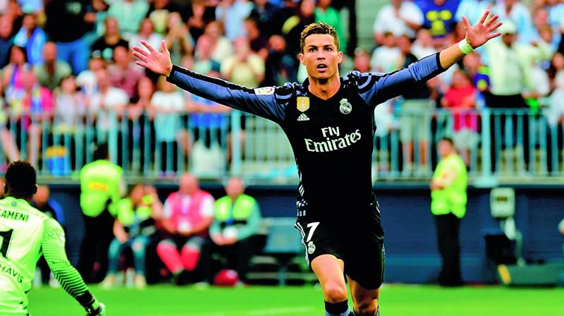 Cristiano Ronaldo celebrates his goal against Malaga (Photo: AP) Cristiano Ronaldo celebrates his goal against Malaga (Photo: AP)