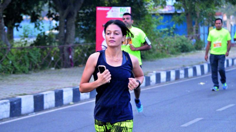 Participants running during the 10K intercity run held at Hussainsagar in Hyderabad on Sunday. (Phyoto: DC) Participants running during the 10K intercity run held at Hussainsagar in Hyderabad on Sunday. (Phyoto: DC)