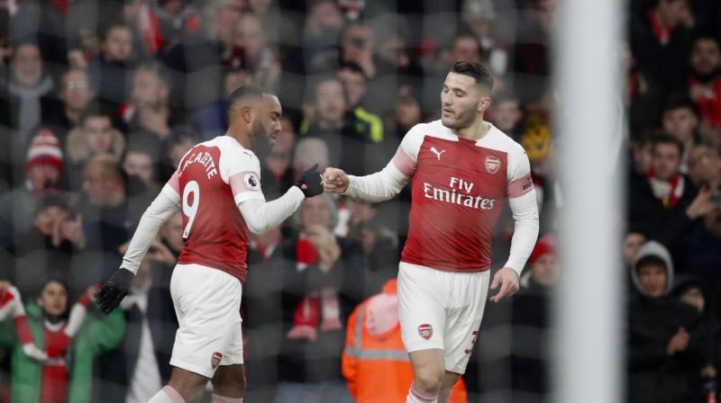 Lacazette celebrates with Kolasinac after scoring the opening goal during the match between Arsenal and Chelsea. (Photo: AP) Lacazette celebrates with Kolasinac after scoring the opening goal during the match between Arsenal and Chelsea. (Photo: AP)