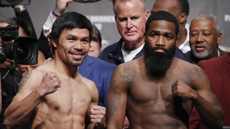Manny Pacquiao and Adrien Broner pose during a weigh-in. (Photo: AP) Manny Pacquiao and Adrien Broner pose during a weigh-in. (Photo: AP)