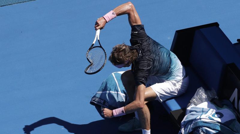 Alexander Zverev smashes his racket in frustration during his fourth round match against Milos Raonic at the Australian Open. (Photo: PTI) Alexander Zverev smashes his racket in frustration during his fourth round match against Milos Raonic at the Australian Open. (Photo: PTI)