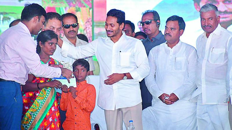 AP Chief Minister Y.S. Jagan Mohan Reddy after presenting `7 lakh cheque to a widow Ramasubbamma in Kadapa on Monday. (DC) AP Chief Minister Y.S. Jagan Mohan Reddy after presenting `7 lakh cheque to a widow Ramasubbamma in Kadapa on Monday. (DC)