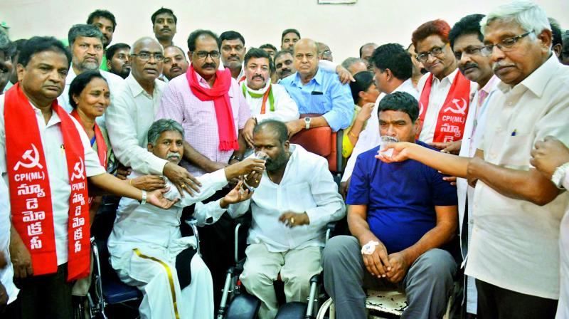 TSRTC JAC leaders Ashwathama Reddy and Raji Reddy end their hunger strike on Monday at Osmania General Hospital. MRPS leader Manda Krishna Madiga, TJS President Prof. Kodandaram and others offered lime juice to the RTC JAC leaders.