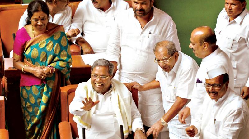 Chief Minister Siddaramaiah, former minister Shamanur Shivashankarappa and newly elected MLA Geetha Mahadevprasad have a hearty laugh during the Assembly session at Vidhana Soudha on Monday. Chief Minister Siddaramaiah, former minister Shamanur Shivashankarappa and newly elected MLA Geetha Mahadevprasad have a hearty laugh during the Assembly session at Vidhana Soudha on Monday.