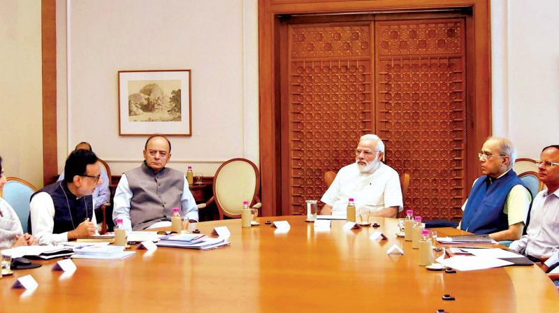 Prime Minister Narendra Modi reviewing the status of GST, which is to be implemented from July 1, in New Delhi on Monday. (Photo: PTI) Prime Minister Narendra Modi reviewing the status of GST, which is to be implemented from July 1, in New Delhi on Monday. (Photo: PTI)