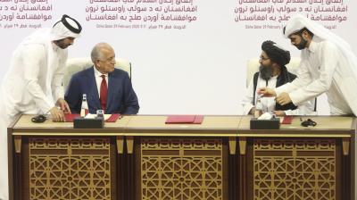 U.S. peace envoy Zalmay Khalilzad, left, and Mullah Abdul Ghani Baradar, the Taliban group's top political leader sign a peace agreement between Taliban and U.S. officials in Doha, Qatar. The Taliban say the long-awaited peace talks with the negotiating team selected by the Afghan government are to begin on Saturday, Sept. 12, 2020, in the Gulf Arab state of Qatar. The announcement on Sept. 10, came in a statement from the Taliban in Qatar, where the insurgents maintain a political office, and also as an announcement from Qatar's foreign ministry. (AP File)