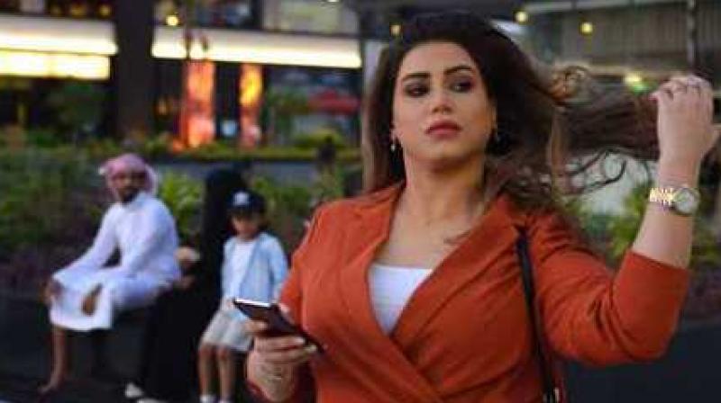 The 33-year-old human resources specialist strolled through a mall in central Riyadh last week wearing nothing but a burnt orange top over baggy trousers. (Photo: AFP) The 33-year-old human resources specialist strolled through a mall in central Riyadh last week wearing nothing but a burnt orange top over baggy trousers. (Photo: AFP)
