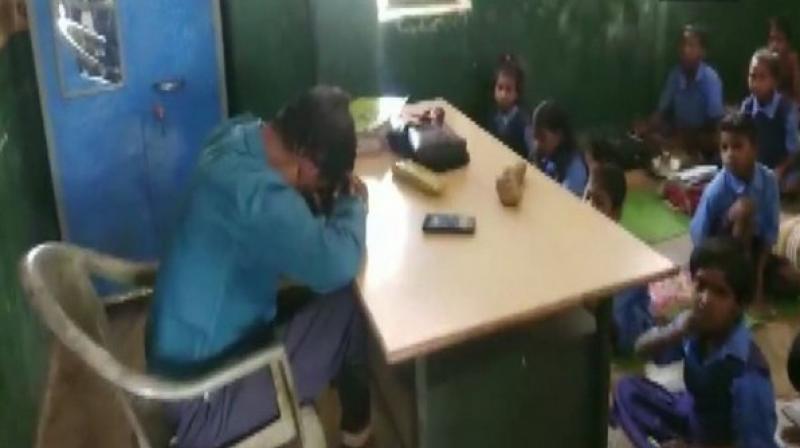 Locals were demanding strictest action against the teacher from the authorities after they were informed by the students about the teacher's conduct and had gone to wake him up in the classroom. (Photo: ANI) Locals were demanding strictest action against the teacher from the authorities after they were informed by the students about the teacher's conduct and had gone to wake him up in the classroom. (Photo: ANI)