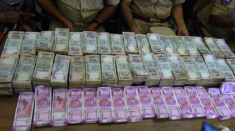 Currency seized during raids (Photo: PTI) Currency seized during raids (Photo: PTI)