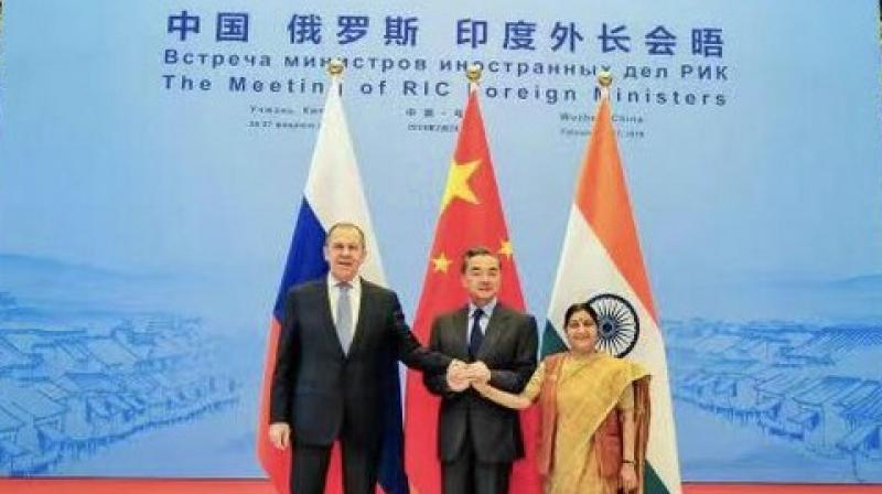 (From right to left) External Affairs Minister Sushma Swaraj, Chinese Foriegn Minister Wang Yi and Russian Foriegn Minister Sergey Lavrov after RIC meet in Wuzhen on Wednesday. (Photo: ANI) (From right to left) External Affairs Minister Sushma Swaraj, Chinese Foriegn Minister Wang Yi and Russian Foriegn Minister Sergey Lavrov after RIC meet in Wuzhen on Wednesday. (Photo: ANI)