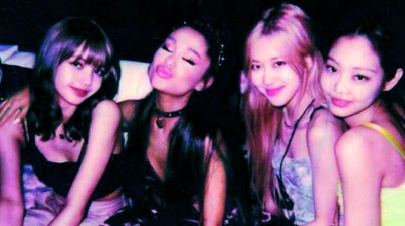 Tommy uploaded another hilarious photo to his account, editing Ariana into the middle of his photo booth shot with the K-pop girl group, captioning it, “Sry here’s the real one.” Tommy uploaded another hilarious photo to his account, editing Ariana into the middle of his photo booth shot with the K-pop girl group, captioning it, “Sry here’s the real one.”