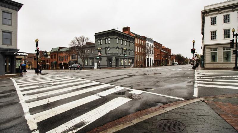 The streets in the shopping district of Georgetown are nearly empty Wednesday on March 25, 2020, in Washington (AP) The streets in the shopping district of Georgetown are nearly empty Wednesday on March 25, 2020, in Washington (AP)